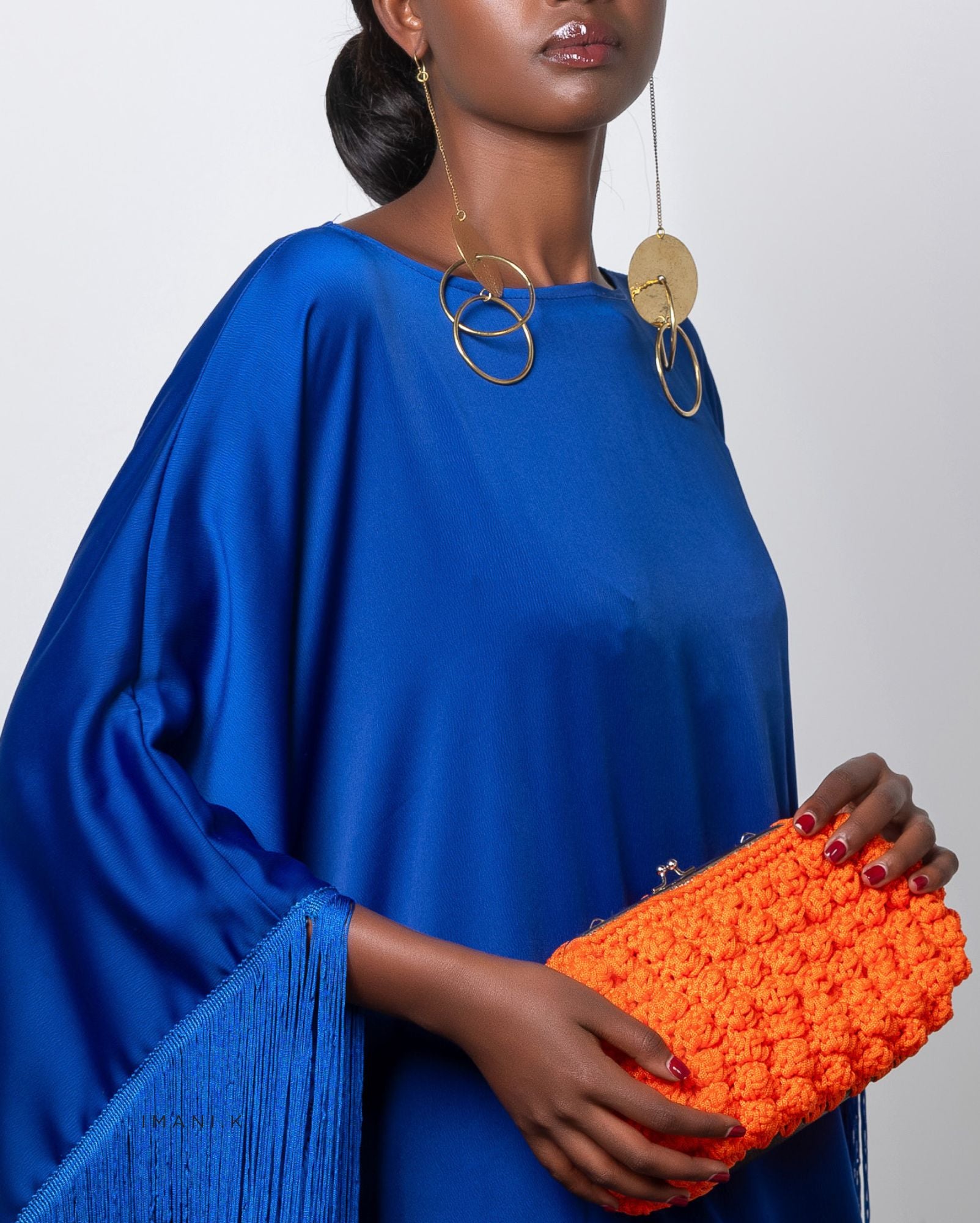 Clothing: IMANI.K
Earrings: Murembo Collection
Bag: Habba Creations